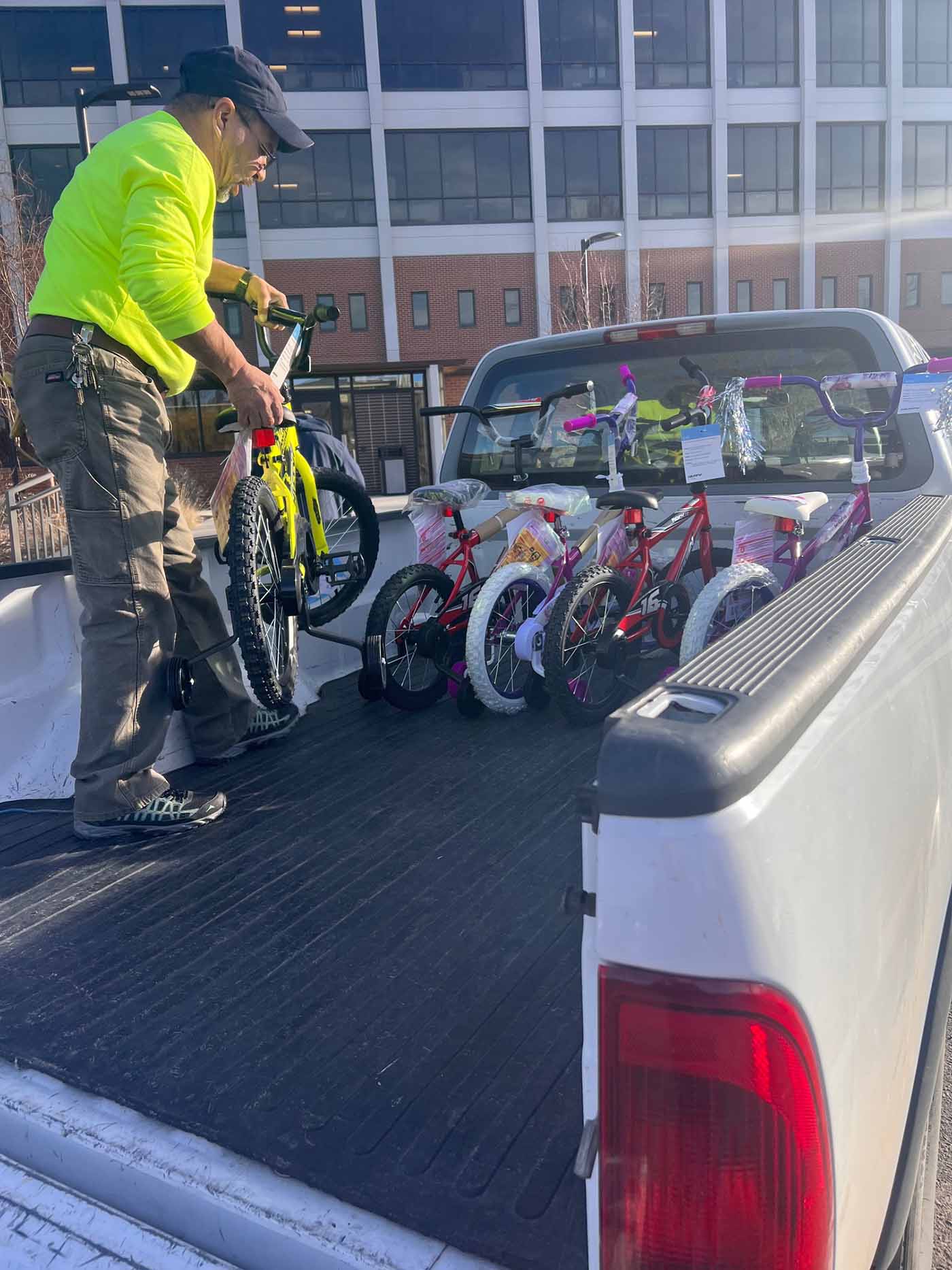 Man putting bikes in truck